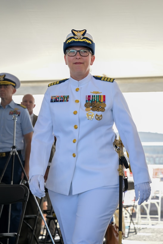 Capt. Kristen Serumgard approaches the stage for the Coast Guard Cutter Healy (WAGB-20) change-of-command ceremony in Seattle, June 10, 2025. Serumgard previously served at Coast Guard Headquarters as part of the Office of Arctic Strategy, Policy, and International Engagement. (U.S. Coast Guard photo by Petty Officer 3rd Class Annika Hirschler)