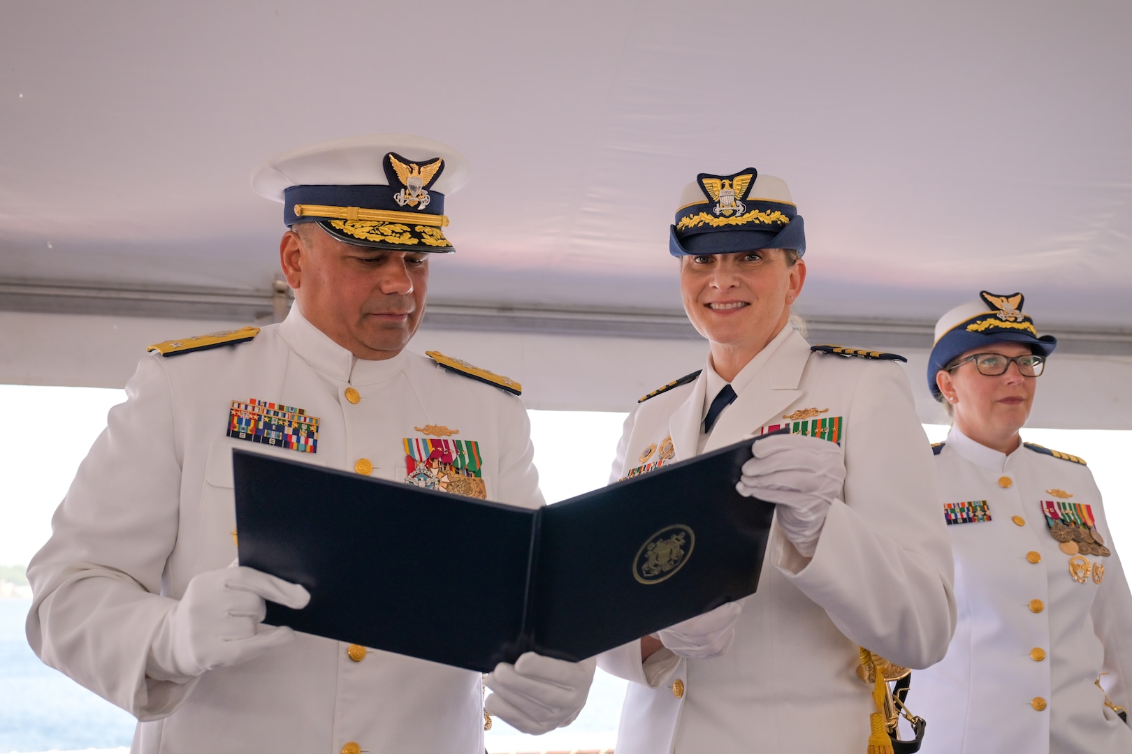 Capt. Michele Schallip was presented an award for her work as commanding officer of the Coast Guard Cutter Healy (WAGB-20) during the change of command ceremony in Seattle, June 10, 2025. Schallip, the first woman to command Healy, led the cutter through multiple Arctic deployments. (U.S. Coast Guard photo by Petty Officer 3rd Class Annika Hirschler)