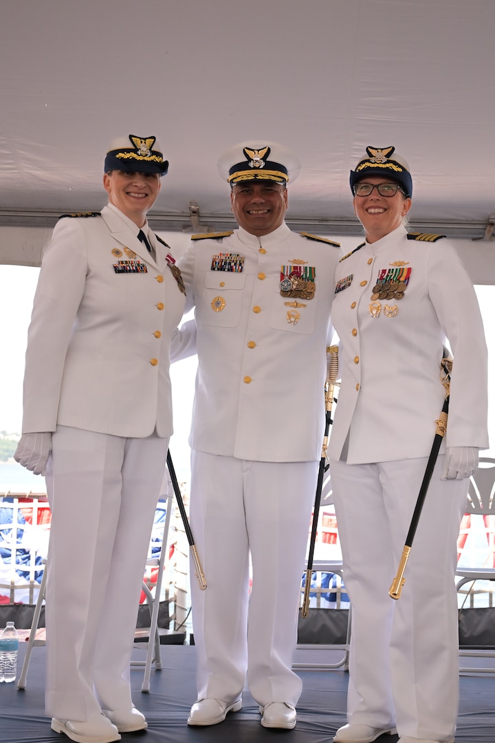 Vice Adm. Andrew Tiongson, Capt. Michele Schallip and Capt. Kristen L. Serumgard congratulate one another after the Coast Guard Cutter Healy (WAGB-20) change of command ceremony in Seattle, June 10, 2025. The ceremony marked a leadership transition aboard the nation's sole medium icebreaker. (U.S. Coast Guard photo by Petty Officer 3rd Class Annika Hirschler)