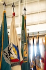 An array of flags are presented during the Army Field Support Battalion-Charleston change of command ceremony at Joint Base Charleston.