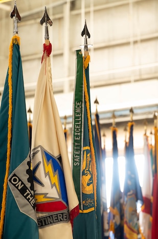 An array of flags are presented during the Army Field Support Battalion-Charleston change of command ceremony at Joint Base Charleston.