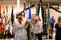 U.S. Army Lt. Col. Stuart Williams, outgoing Army Field Support Battalion-Charleston commander, poses for photos with his family following the AFSBn-CHS change of command ceremony at Joint Base Charleston.