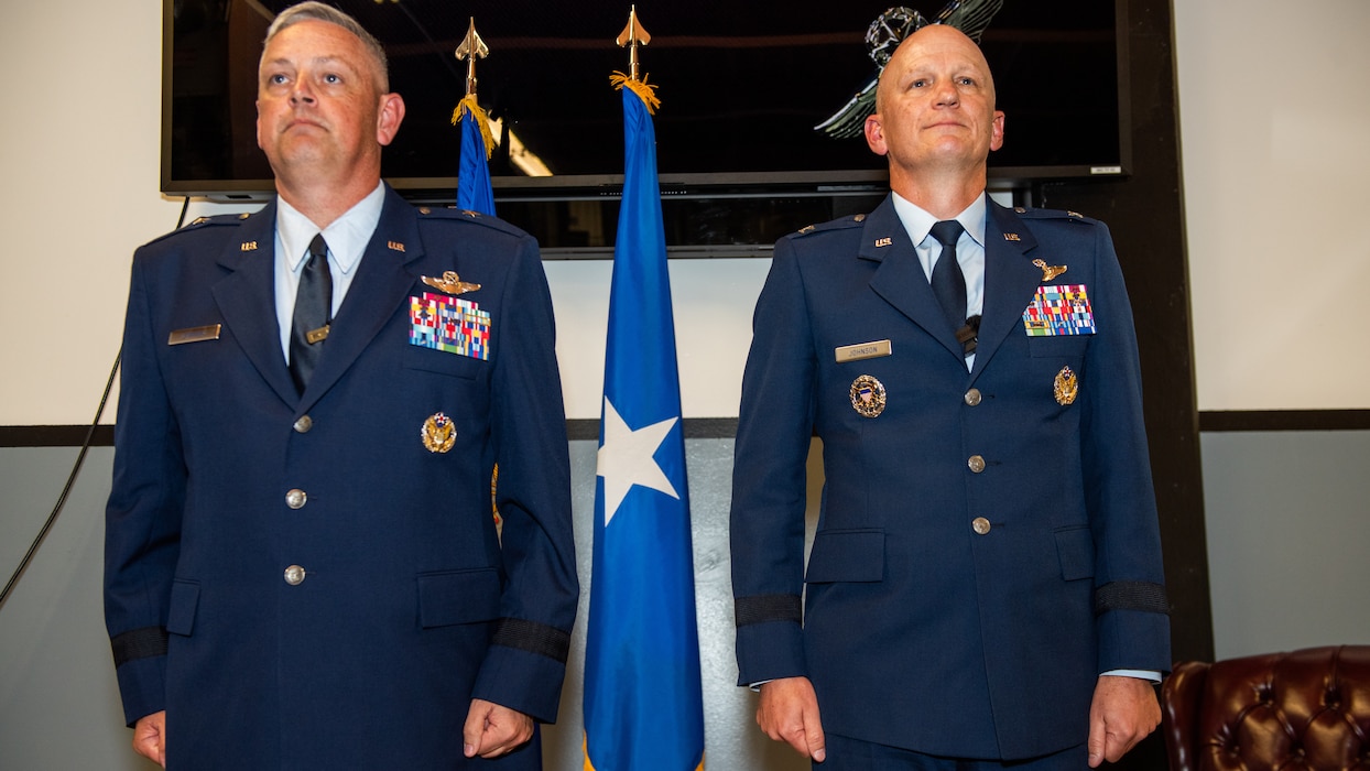 General and colonel stand at attention