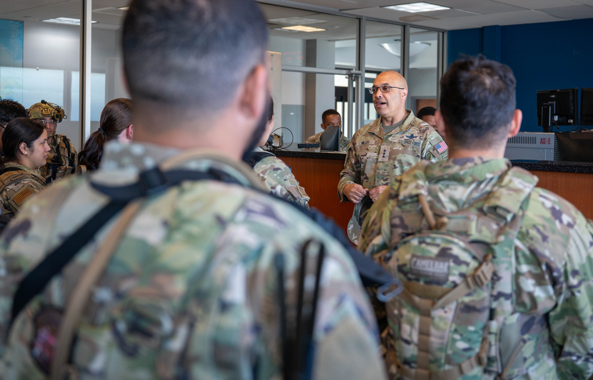 Lt. Gen. Miller speaks to a room full of security forces members