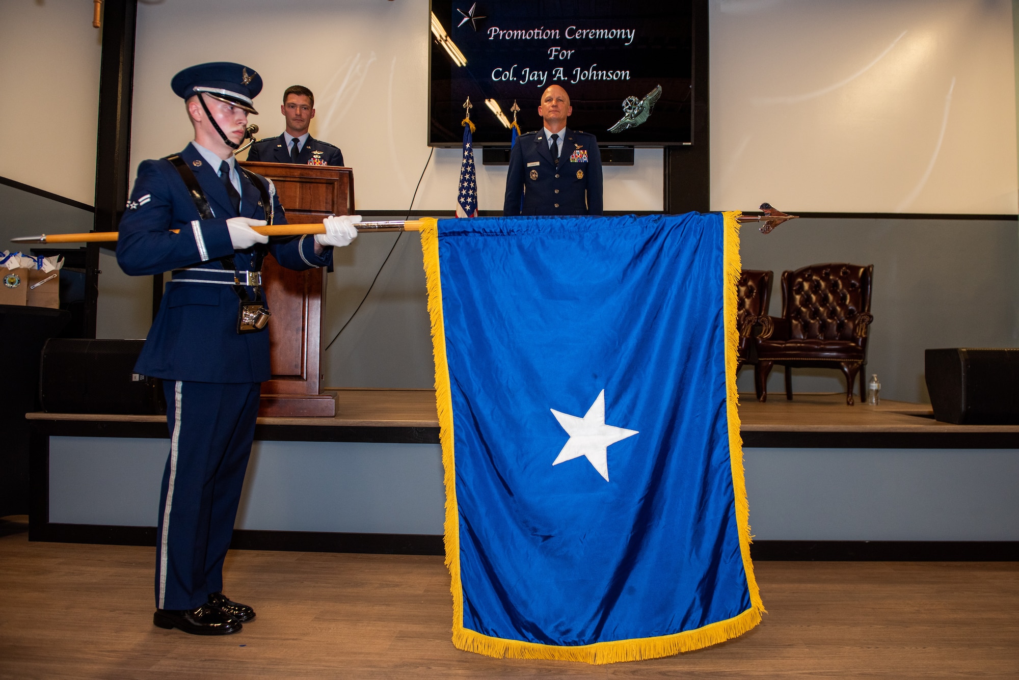 Airman unfurls general's personal flag