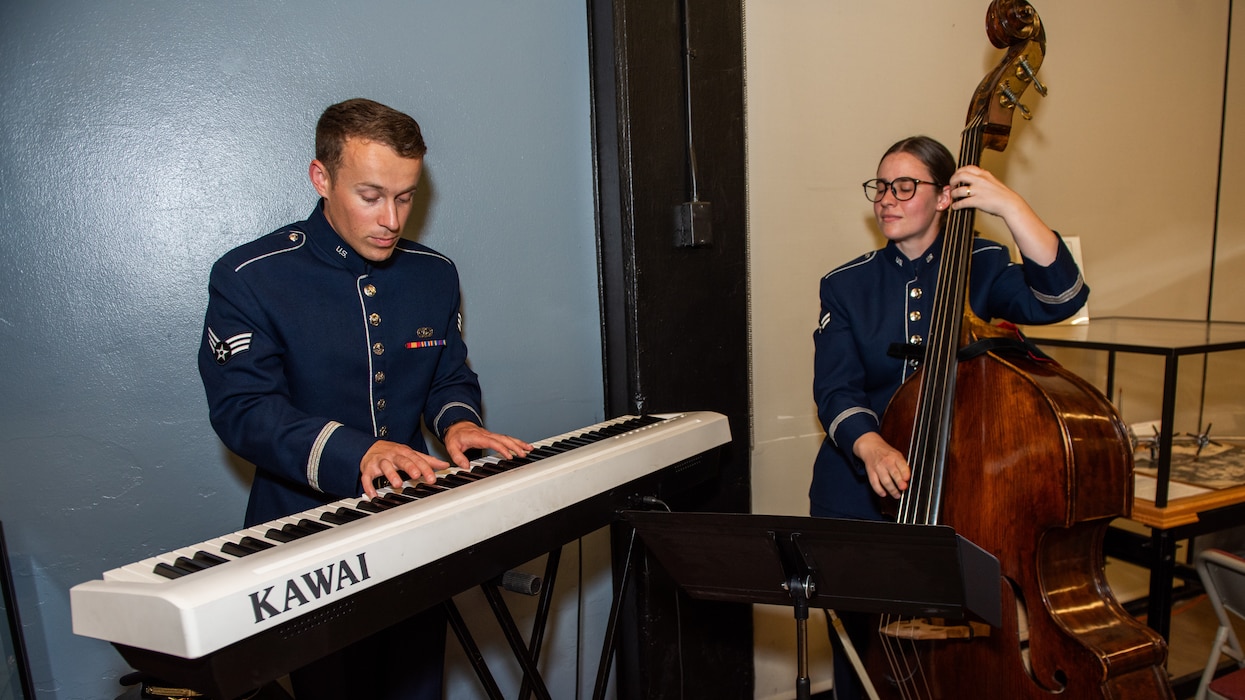 Band members playing piano and cello