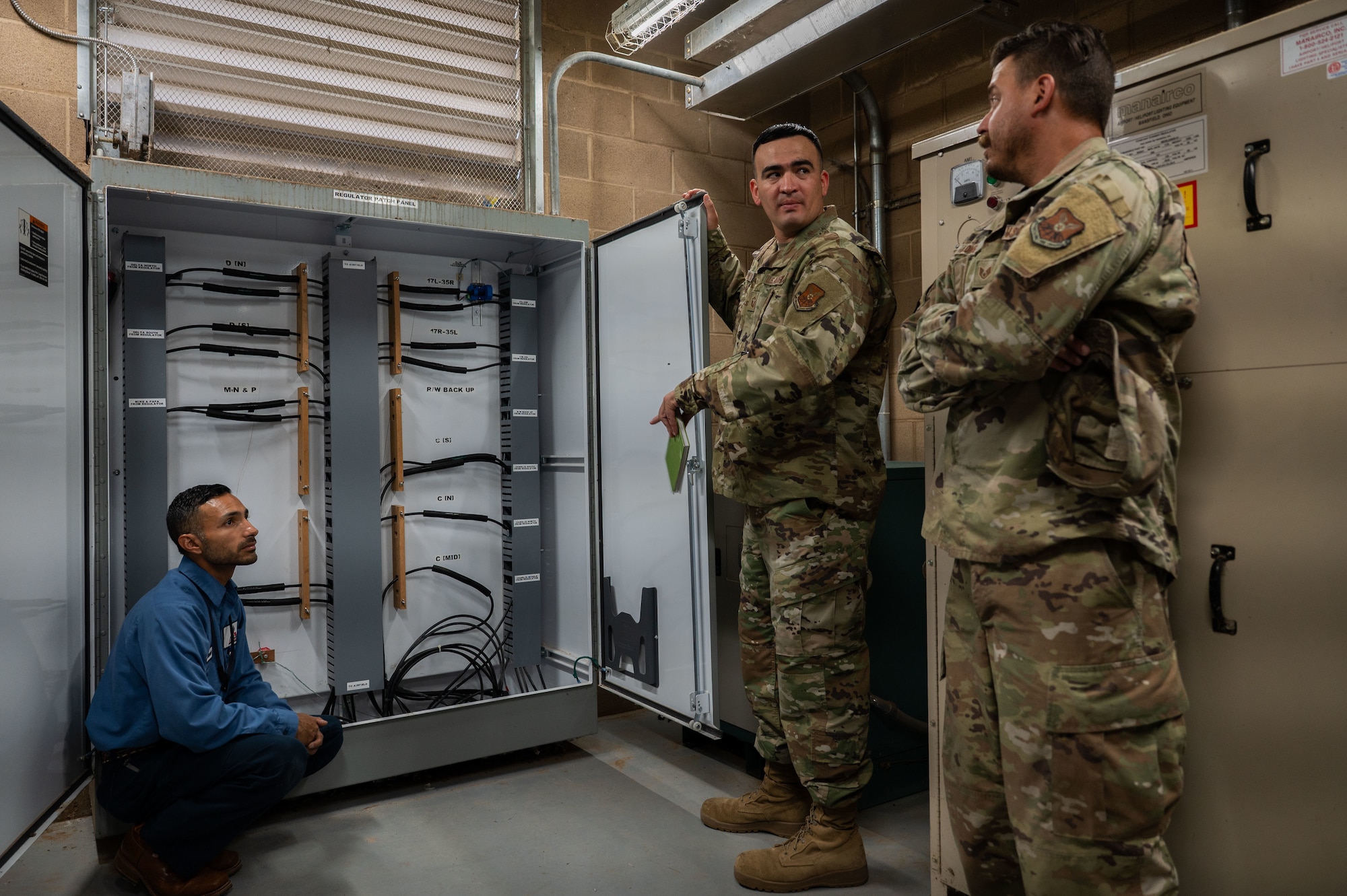 Monty Murillo, Abilene Regional Airport electrical systems superintendent, shares information on electrical procedures with U.S. Air Force Master Sgt. Domanic Gonzalez, 7th Civil Engineer Squadron facilities superintendent, and Staff Sgt. William Long, 7th CES electrical systems craftsman, during a knowledge exchange at Abilene Regional Airport, June 6, 2025. This collaboration event and partnership fosters mutual support, ensuring seamless airfield operations and strengthened community bonds crucial for Dyess AFB's mission success. (U.S. Air Force photo by Senior Airman Alondra Cristobal Hernandez)