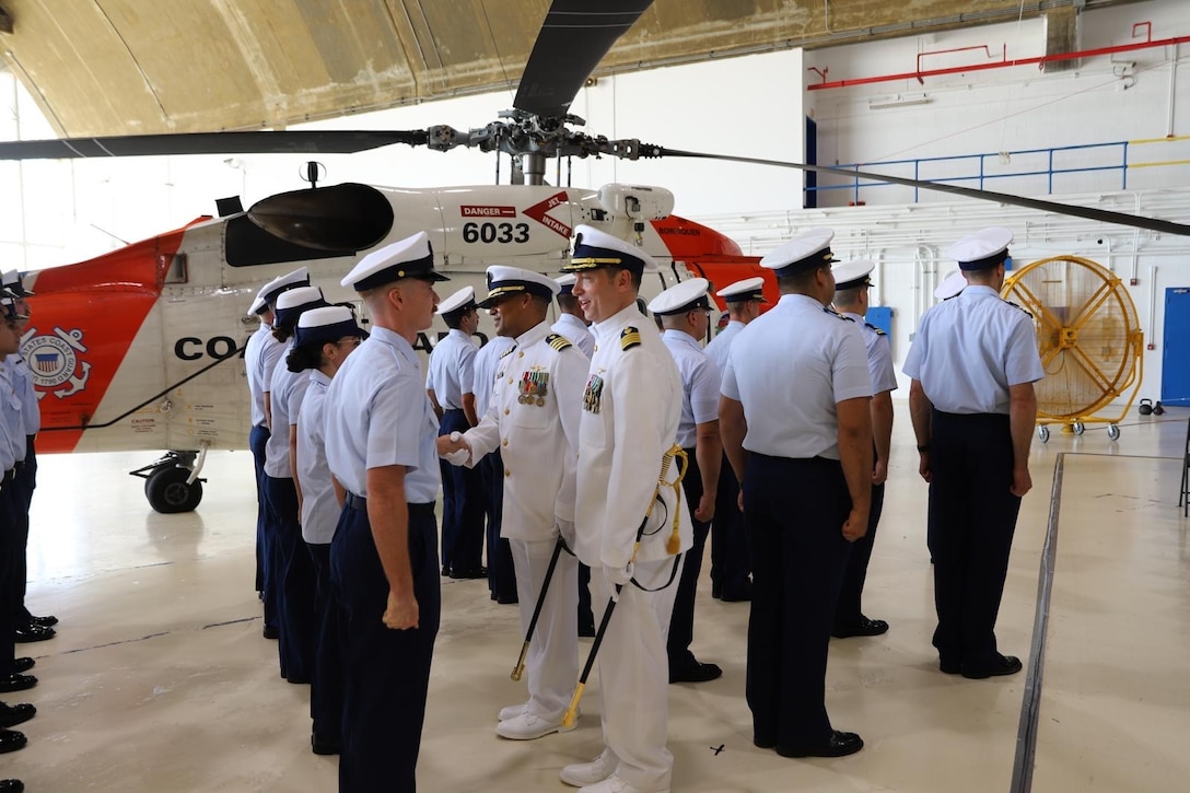 Capt. Lawrence Gaillard and Capt. Jeffrey P. Owens inspect Air Station Borinquen’s honor formation during the unit’s change of command ceremony in Aguadilla, Puerto Rico, June 11, 2025. During the ceremony, Owens relieved Gaillard as the commanding officer of Air Station Borinquen. (U.S. Coast Guard photo courtesy of Coast Guard Auxiliarist Oscar Salinas)