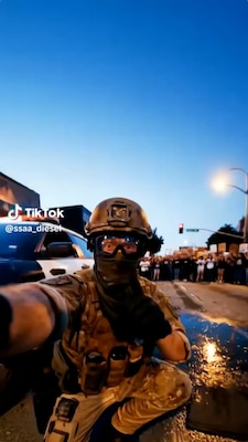 AI-generated man wearing a camoflage uniform appearing to hold a phone offscreen.
