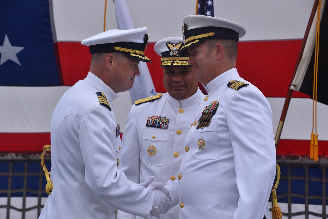 Capt. Andrew Pate and Capt. Billy Mees shook hands during the change of command ceremony for Coast Guard Cutter Bertholf (WMSL 750) Mees served as Bertholf’s commanding officer from June 2023 to June 2025. Under Mees’ leadership, Bertholf deployed to the Bering Sea, Western Pacific and Oceania in support of domestic and illegal, unregulated, unreported fisheries and building international partnerships. (U.S. Coast Guard photo by Lt. j.g Tyler Ma)