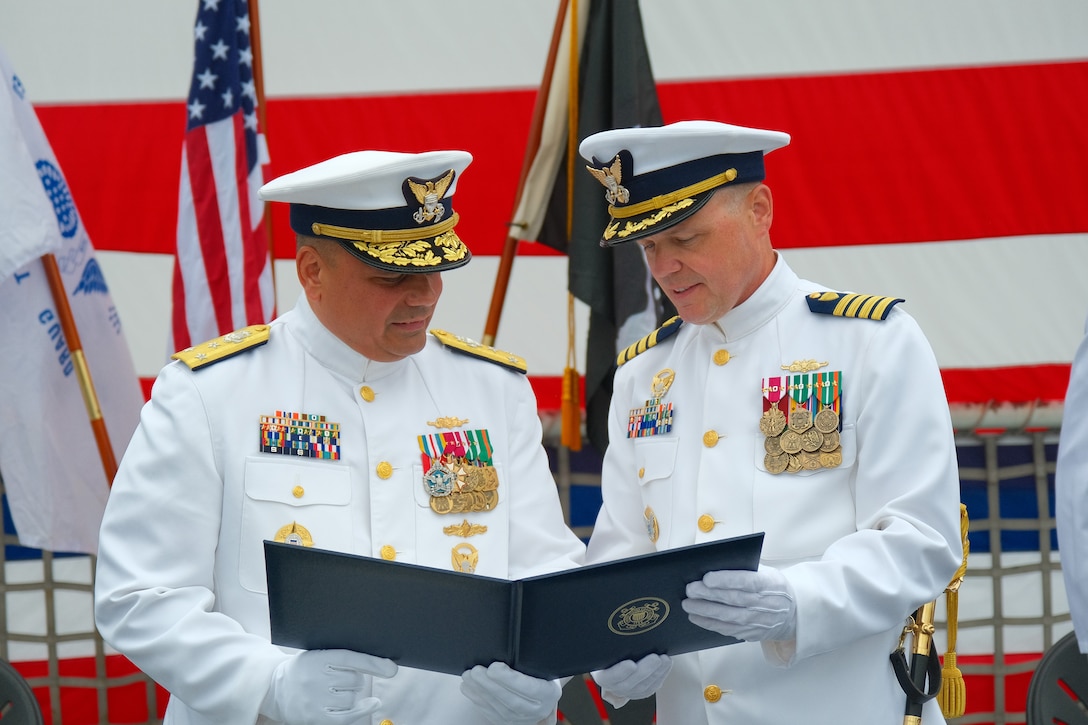 Vice Adm. Andrew Tiongson, commander of Coast Guard Pacific Area, presented an award to Capt. Billy Mees, commanding officer of Coast Guard Cutter Bertholf (WMSL 750) during the change of command ceremony, Monday, Jun. 9, in San Diego. Mees served as Bertholf’s commanding officer from June 2023 to June 2025. Under Mees’ leadership, Bertholf deployed to the Bering Sea, Western Pacific and Oceania in support of domestic and illegal, unregulated, unreported fisheries and building international partnerships. (U.S. Coast Guard photo by Lt. j.g Tyler Ma)