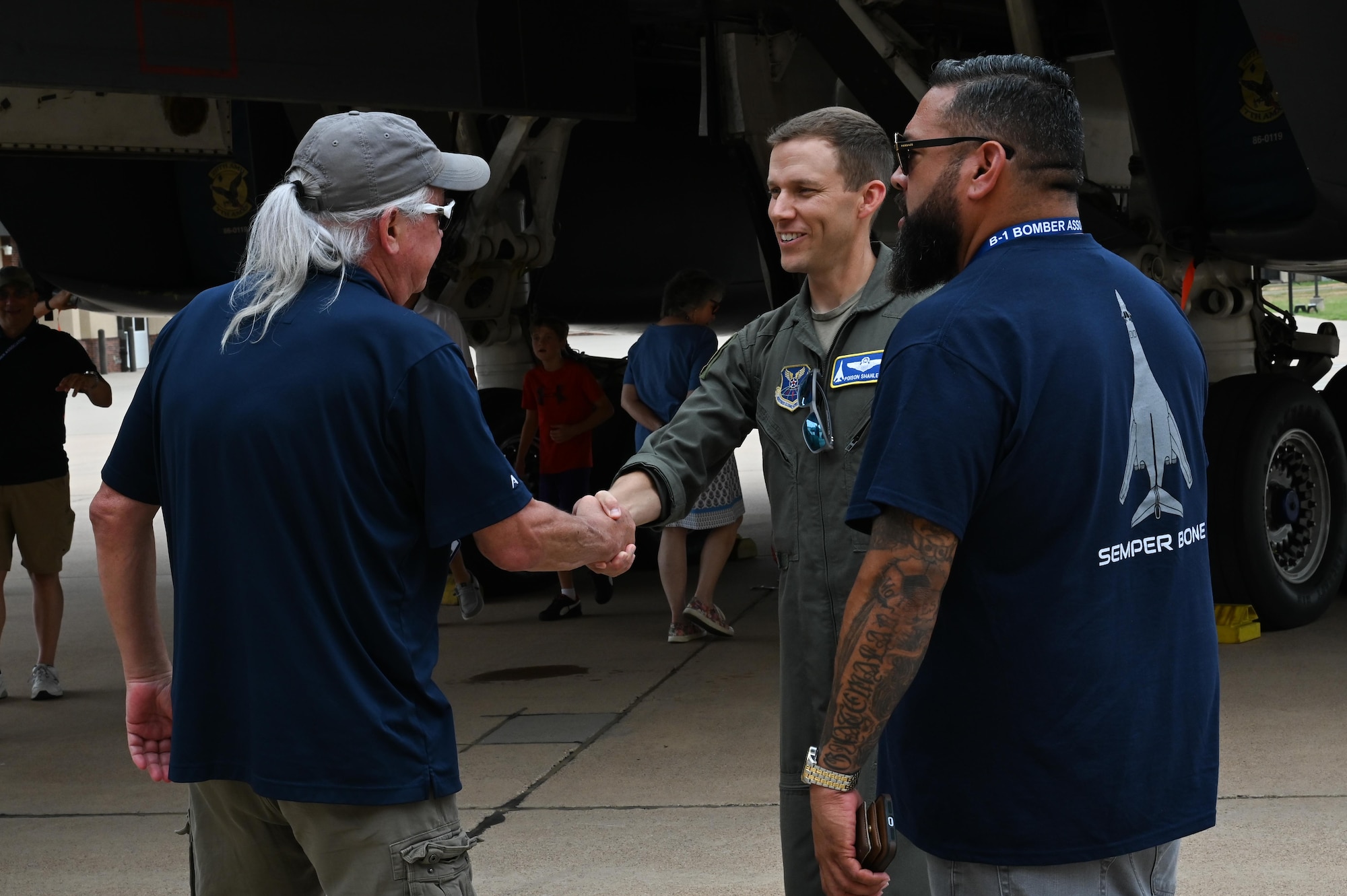 U.S. Air Force Lt. Col. Brian Shanley, 7th Operations Support Squadron commander, shakes the hand of a retired U.S. Air Force Veteran during the B-1 Reunion at Dyess Air Force Base, Texas, June 7, 2025. Dyess AFB hosted a reunion with the B-1 Bomber Association to celebrate 40 years of B-1 operations.   (U.S. Air Force photo by Airman 1st Class Adrien Tran)