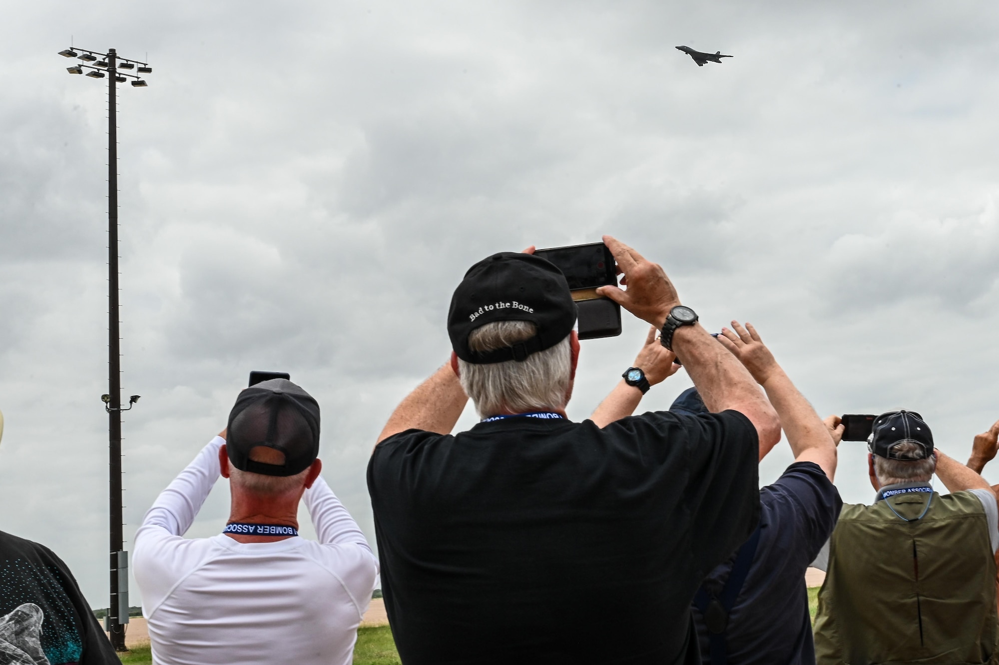 A U.S. Air Force B-1B Lancer performs a flyover in front of retired U.S. Air Force personnel during the B-1 Reunion at Dyess Air Force Base, Texas, June 7, 2025. The reunion united past and present aircrew and maintainers who contributed to the B-1’s distinguished legacy. (U.S. Air Force photo by Airman 1st Class Adrien Tran)
