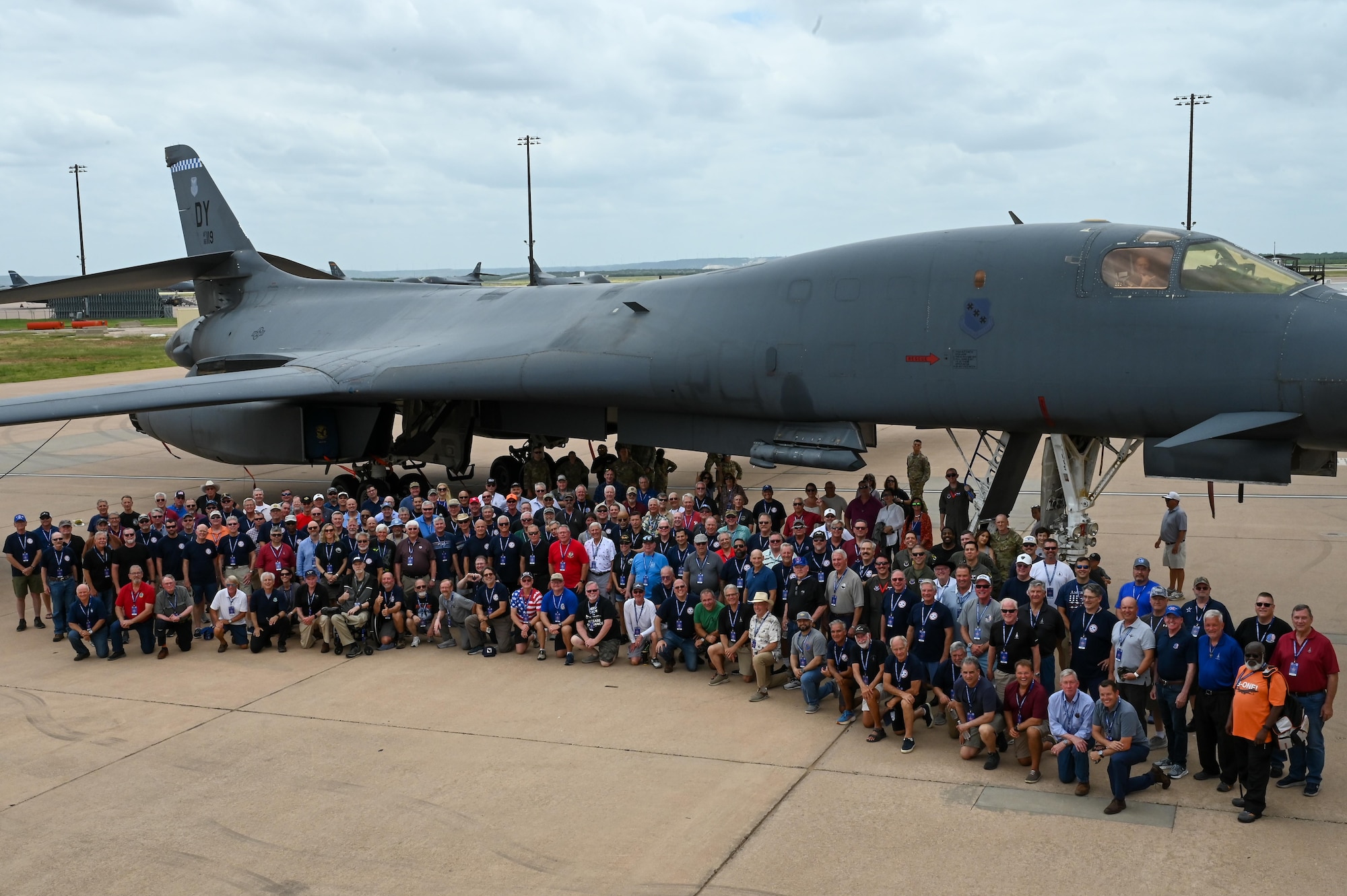 Retired U.S. Air Force personnel gather for a group photo during the B-1 Reunion at Dyess Air Force Base, Texas, June 8, 2025. Dyess AFB hosted a reunion with the B-1 Bomber Association to celebrate 40 years of B-1 operations.  (U.S. Air Force photo by Airman 1st Class Adrien Tran)
