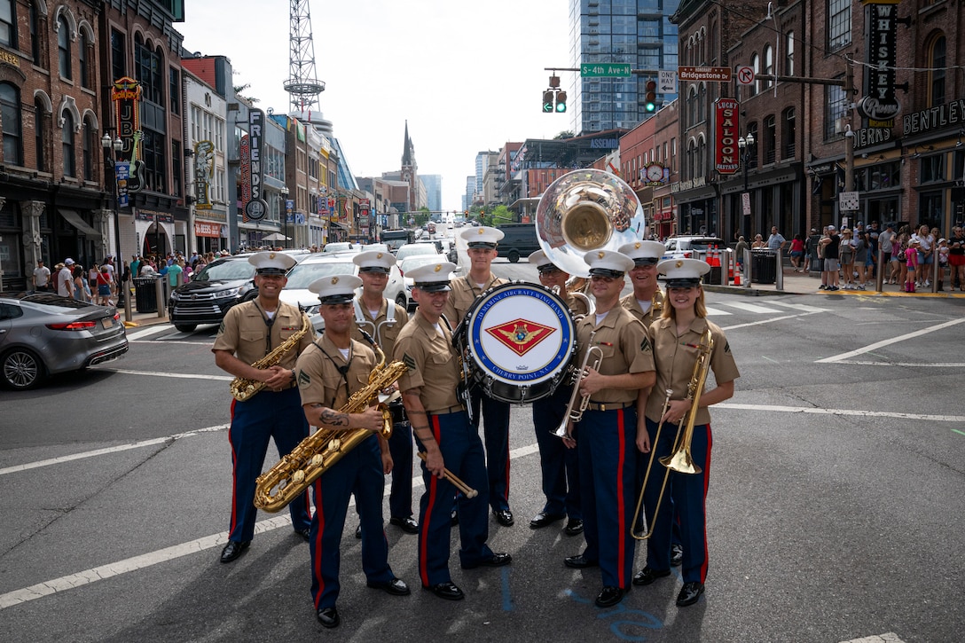 U.S. Marines in the popular music ensemble, with the 2nd Marine Aircraft Wing band, Special Purpose Marine Air-Ground Task Force-250, pose for a photo on Broadway Street during Marine Week Nashville, in Nashville Tennessee, June 5, 2025. Marines set up multiple equipment displays and recruiting booths during Marine Week to engage with the community of Nashville. Throughout 2025, Marines across the globe will celebrate the 250th birthday of the Corps, commemorating, service, sacrifice, and priding themselves on living ‘Semper Fidelis’ or ‘Always Faithful’ to their nation and to each other. (U.S. Marine Corps photo by Cpl. Vincent Needham)