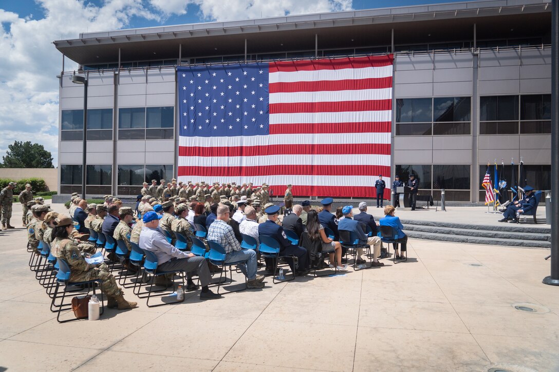 Change of command with flags, Space Fore uniforms and a podium.