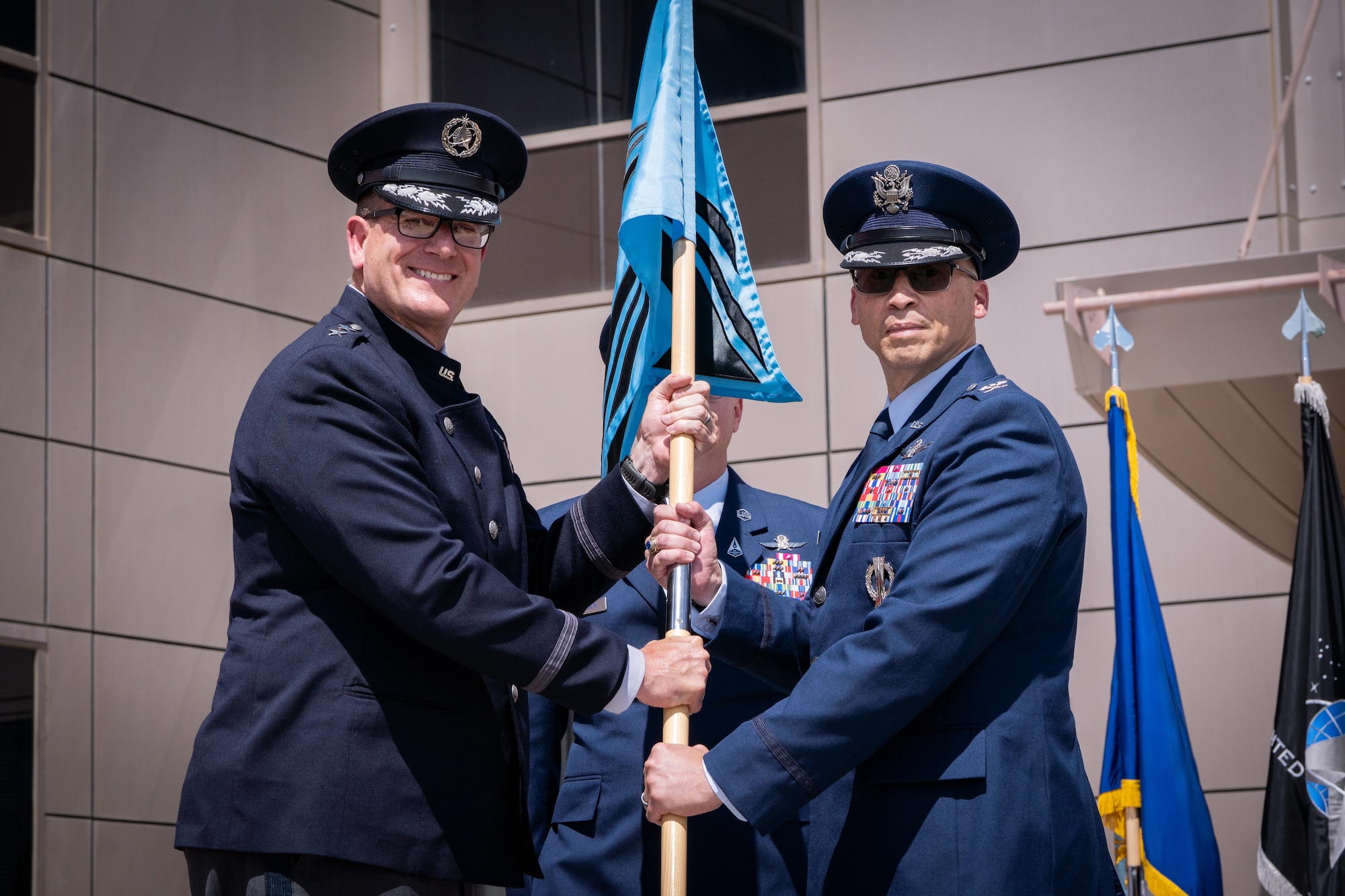 Change of command with flags, Space Fore uniforms and a podium.