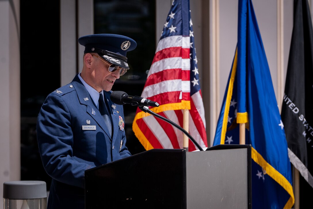 Change of command with flags, Space Fore uniforms and a podium.