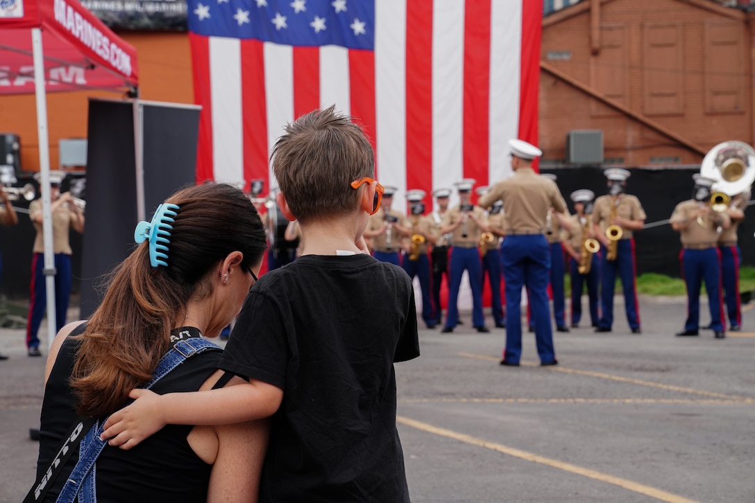 Local Nashville residents watch a live performance by the 2d Marine Aircraft Wing band, Special-Purpose Marine Air-Ground Task Force 250, as part of Marine Week Nashville in Nashville, Tennessee, June 6, 2025. Nashville hosted 2d Marine Aircraft Wing band as a way to show support for the Marine Corps. (Courtesy photo by Sgt. Elizabeth Marino)
