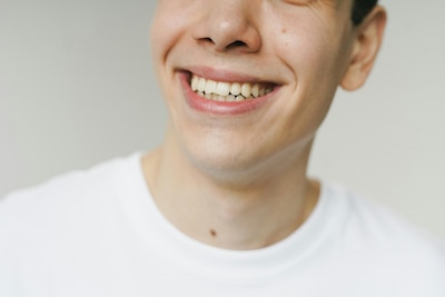Man in white shirt smiling