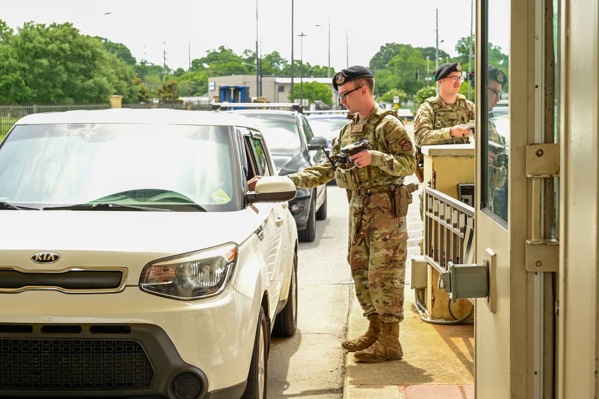 U.S. Air Force Senior Airman Andrew Wilson, 42nd Security Forces Squadron entry controller, checks identification at the Maxwell Air Force Base, Alabama, June 5, 2025.