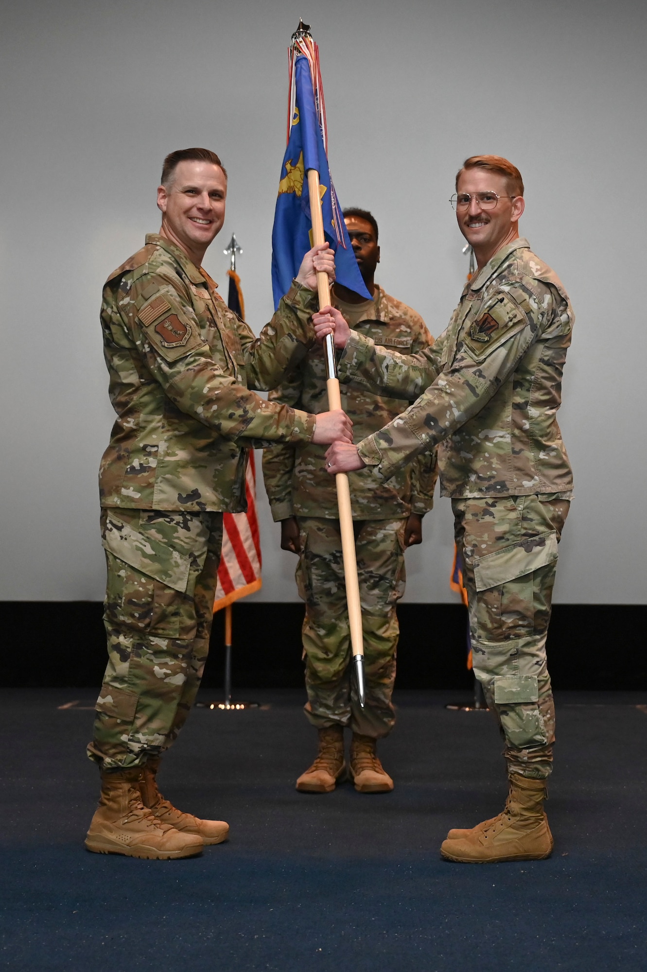 Passing the unit's guidon is a tradition where the outgoing commander symbolically relinquishes responsibility and authority to the incoming commander.