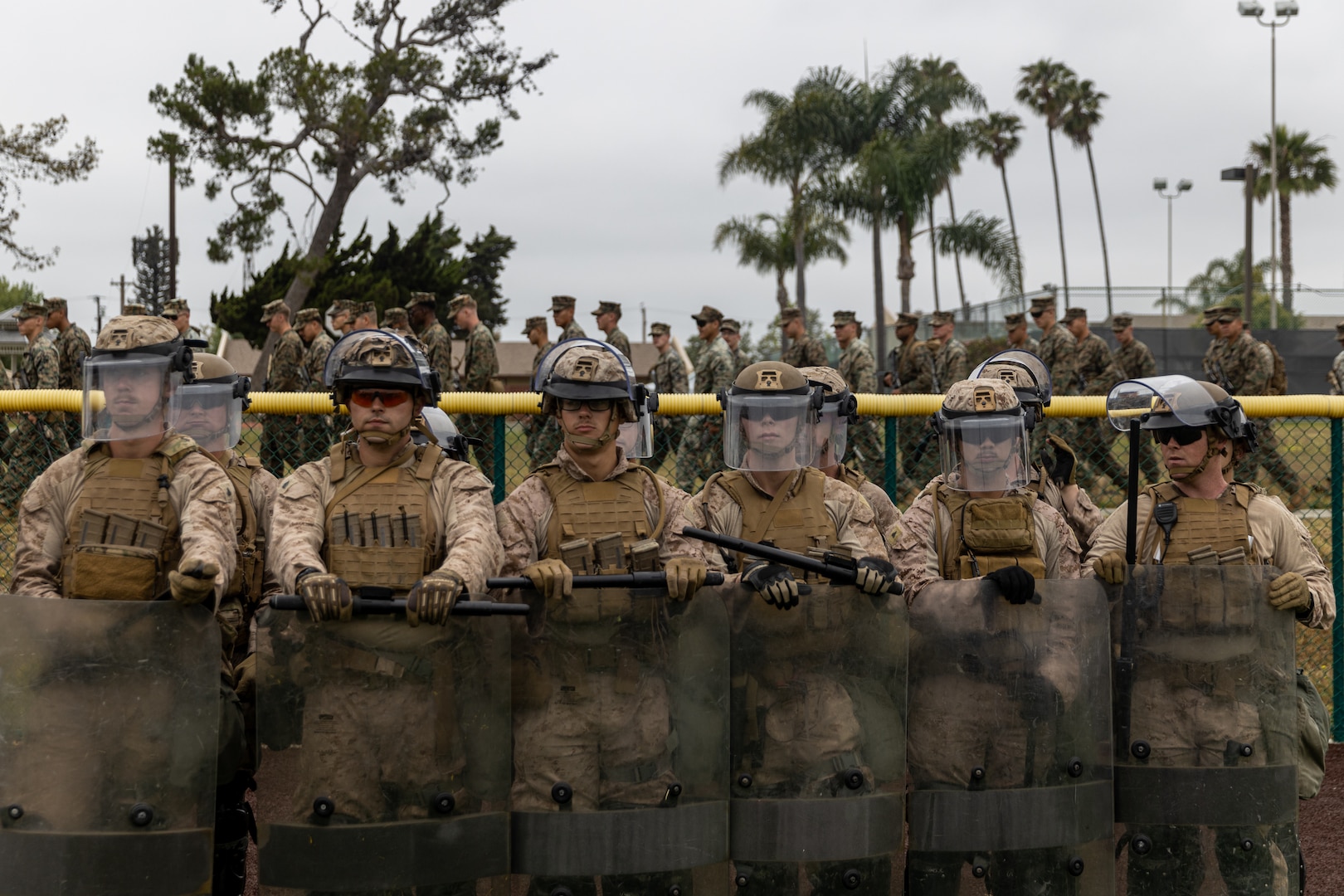 Marines holding protective shields