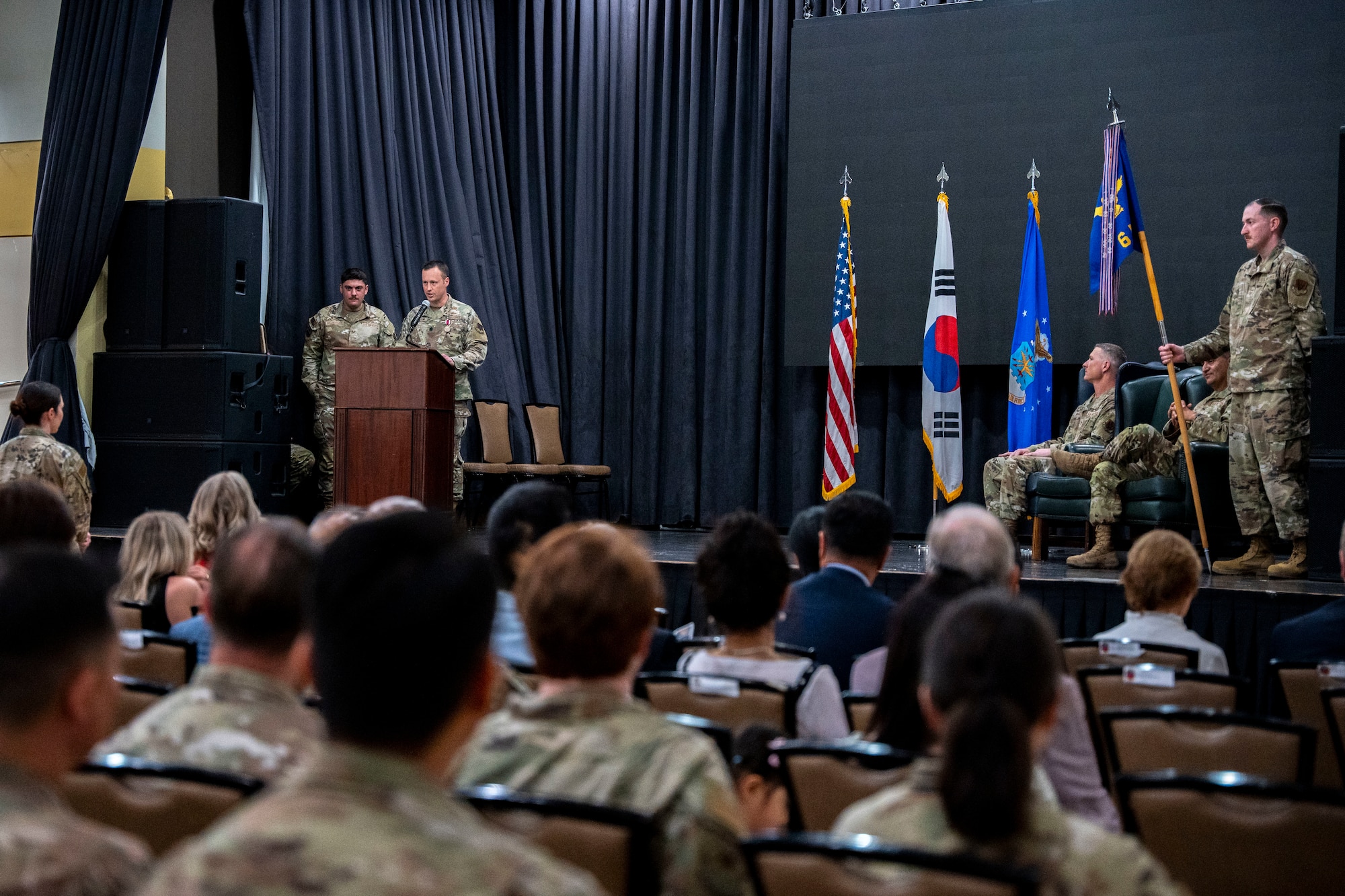 U.S. Air Force Lt. Col. Adam Fossum, outgoing 6th Intelligence Squadron commander, delivers farewell remarks during the 6th IS Change of Command ceremony at Osan Air Base, Republic of Korea, June 11, 2025.