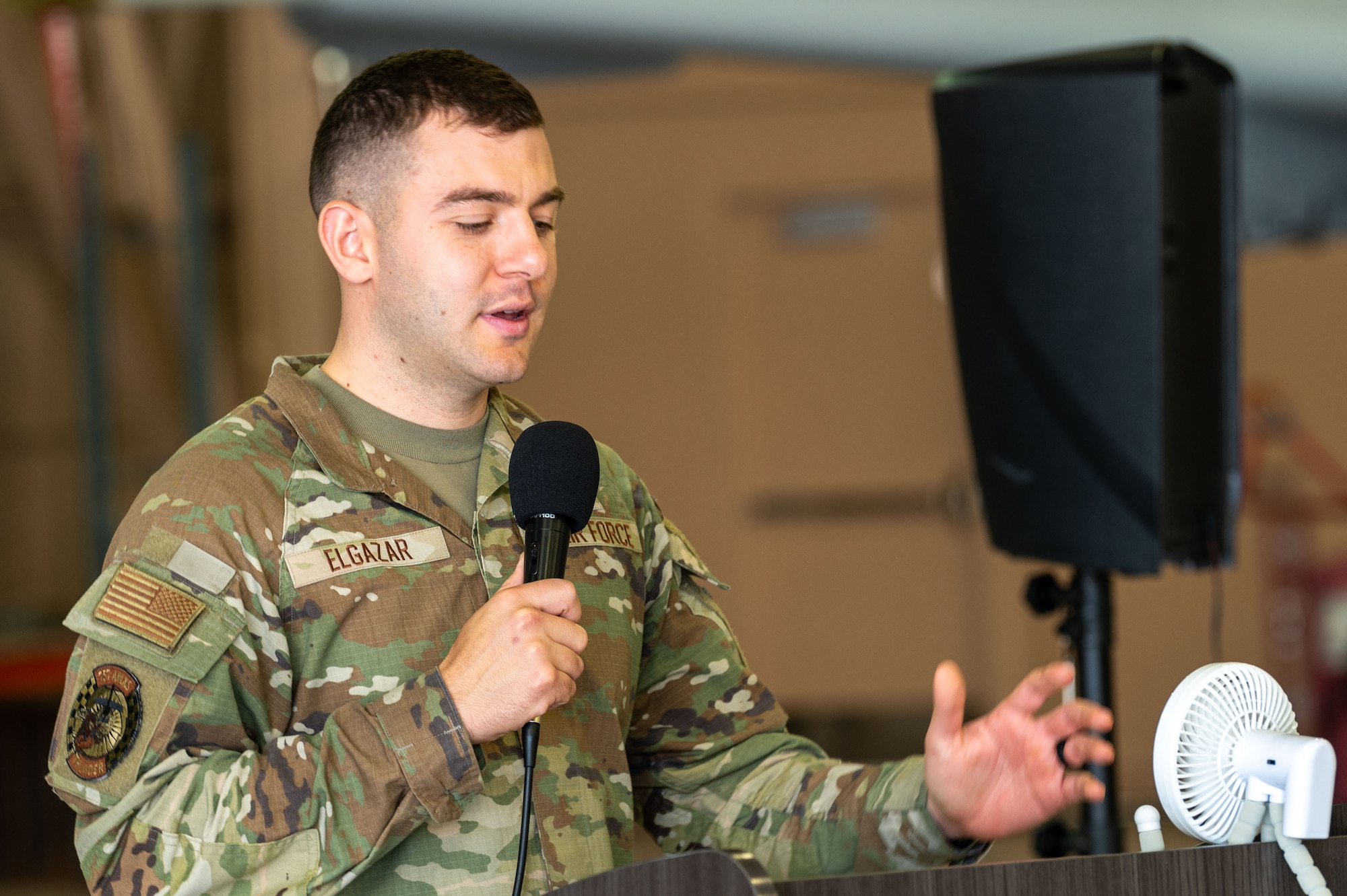 Airman speaks into crowd.