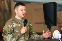 Airman speaks into crowd.
