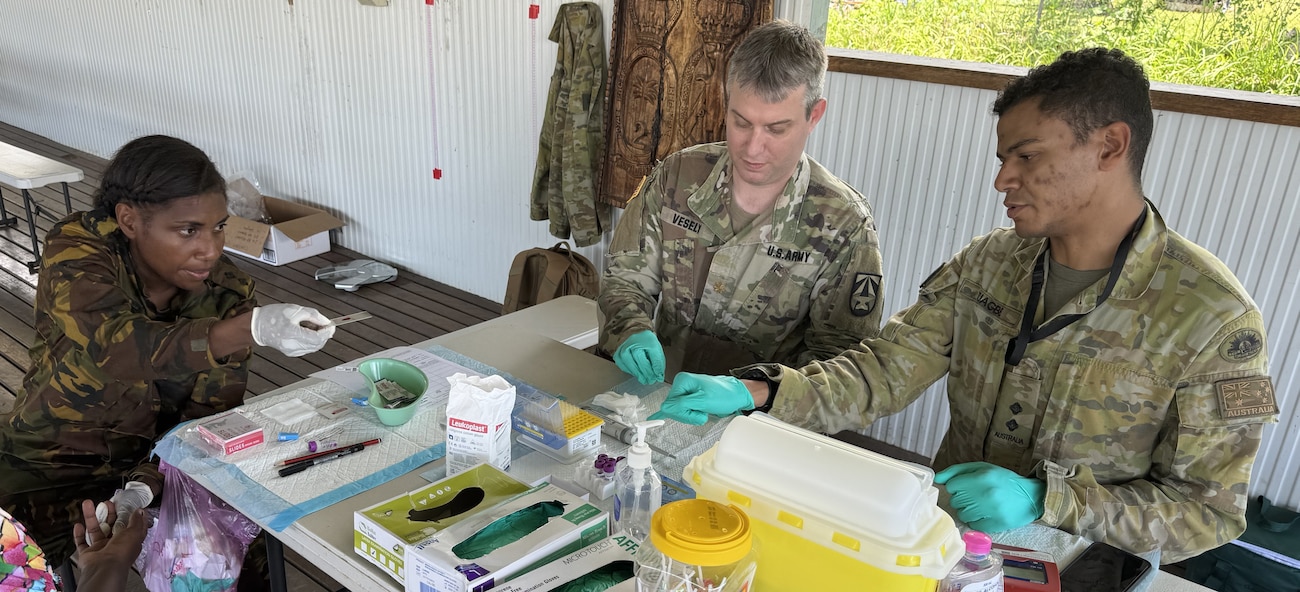 Service members make blood smears as part of the disease surveillance efforts.