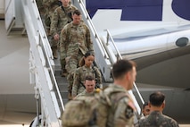 Soldiers of 1st Stryker Brigade Combat Team, 4th Infantry Division, deplane at Osan Air Base, South Korea, May 30, 2025.