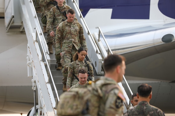 Soldiers of 1st Stryker Brigade Combat Team, 4th Infantry Division, deplane at Osan Air Base, South Korea, May 30, 2025.