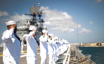 JOINT BASE PEARL HARBOR-HICKAM (June 6, 2025) — Sailors man the rails aboard amphibious assault carrier USS Tripoli (LHA 7), as the ship pulls into Pearl Harbor, Hawaii, June 6, 2025. Tripoli is currently underway in the Pacific Ocean forward...