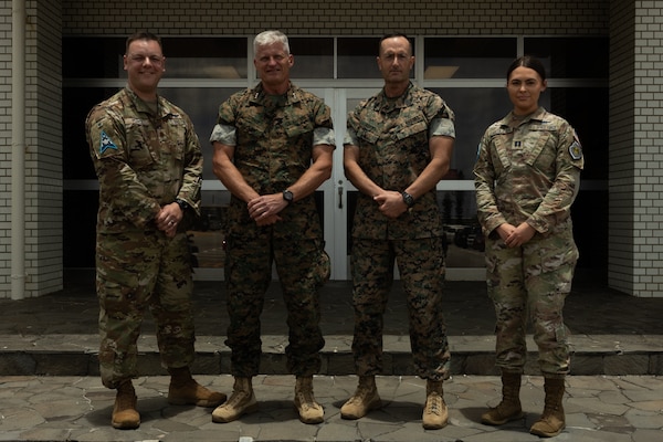 Pearce and Garcia-Park received challenge coins for their efforts during training with III MEF. The Guardians provided subject-matter expertise directly supporting III MEF training.  (U.S. Marine Corps photo by Lance Cpl. Alexander Canal)