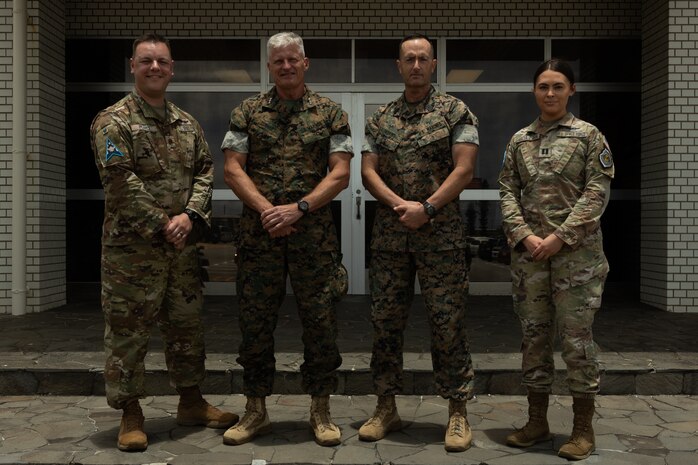 Pearce and Garcia-Park received challenge coins for their efforts during training with III MEF. The Guardians provided subject-matter expertise directly supporting III MEF training.  (U.S. Marine Corps photo by Lance Cpl. Alexander Canal)