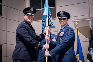 Change of command with flags, Space Fore uniforms and a podium.