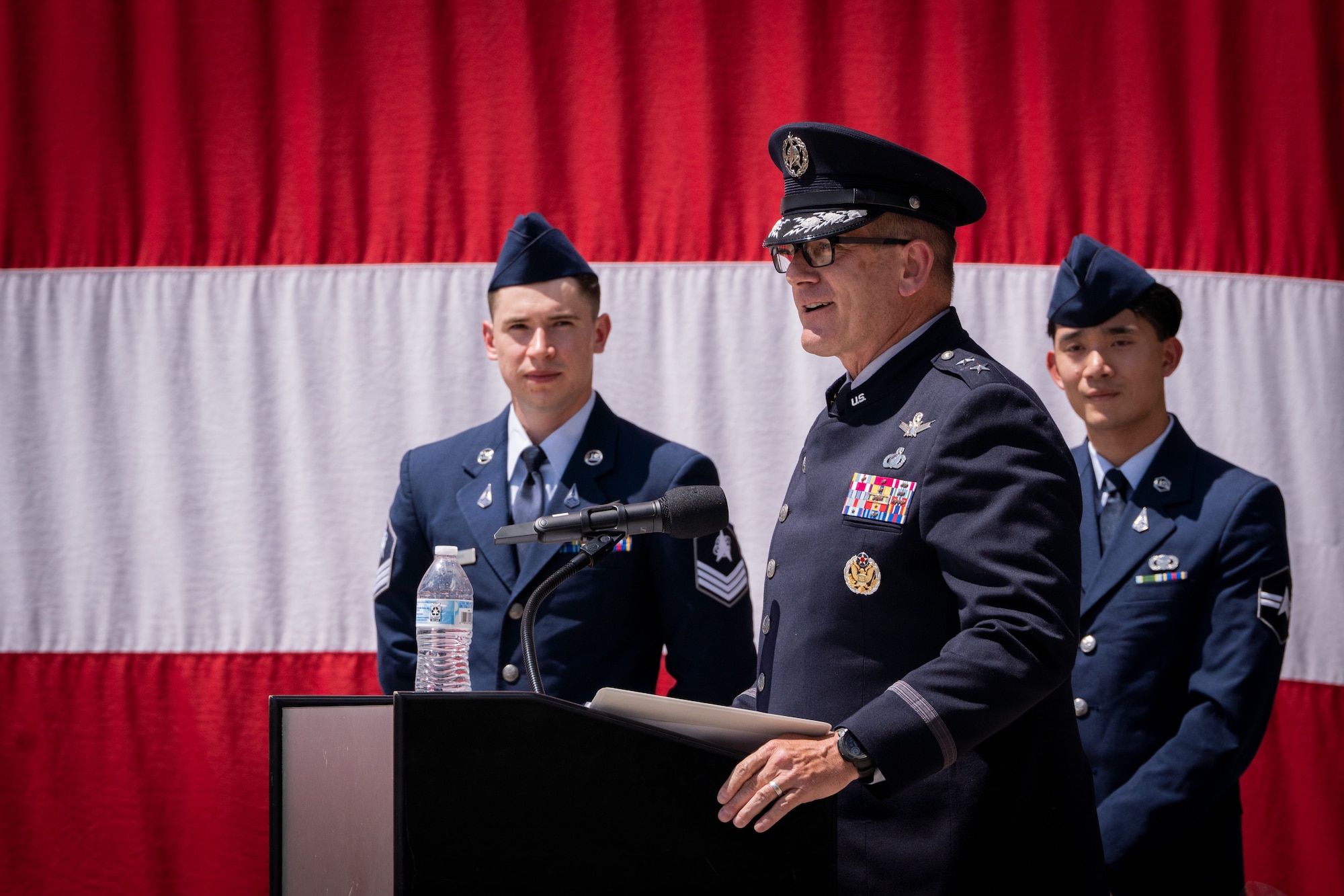 Change of command with flags, Space Fore uniforms and a podium.