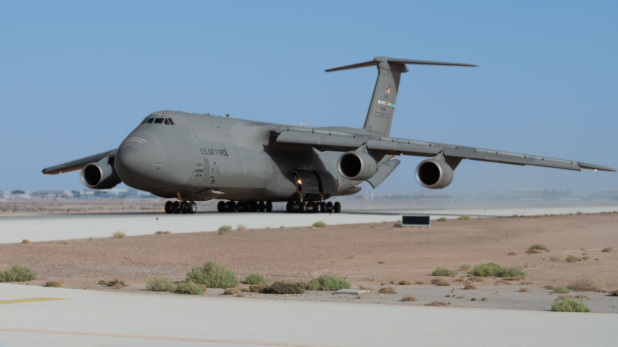 A C-5M taxis.