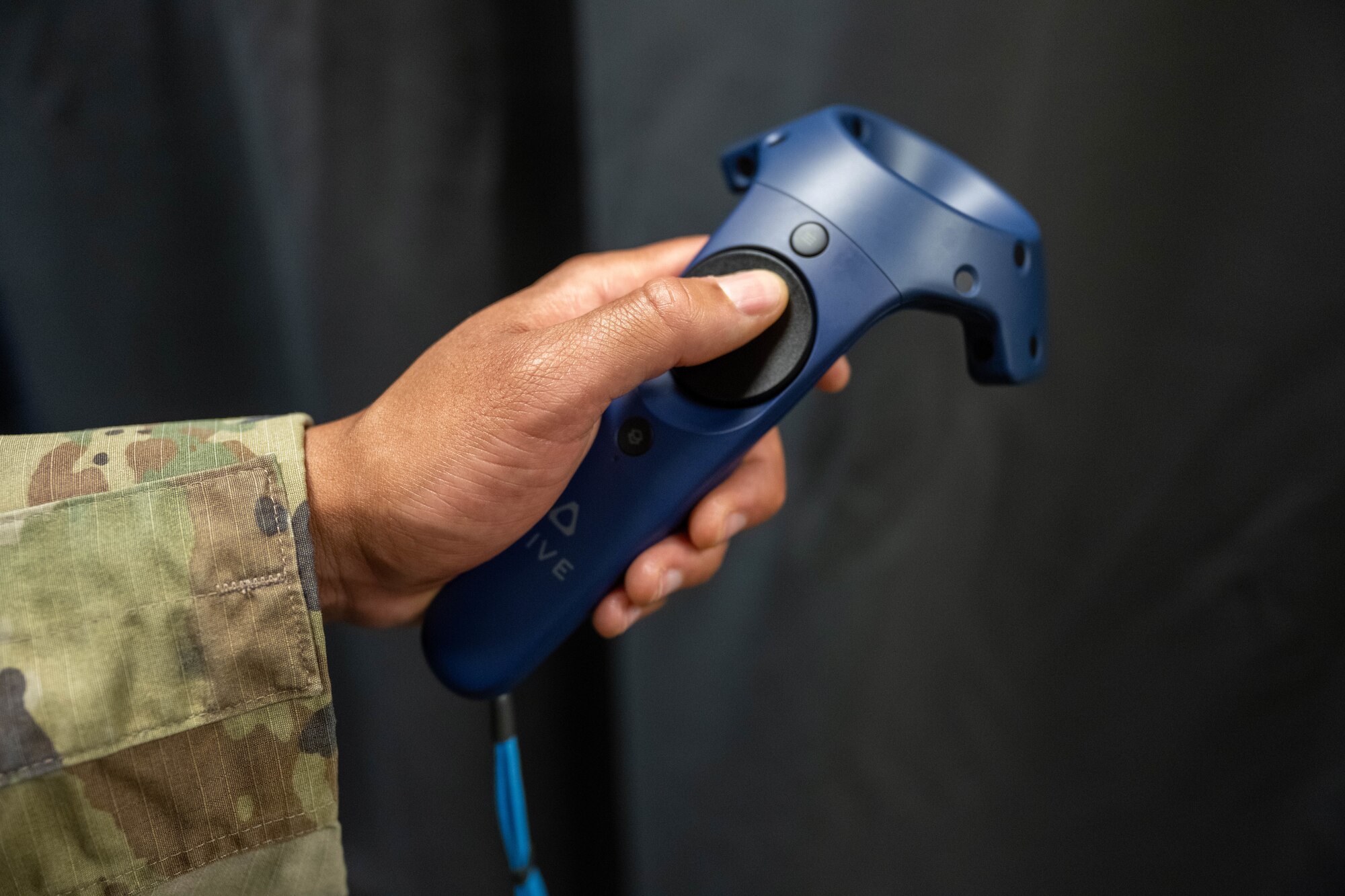 VR joystick held by Airman.
