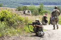 Soldiers with the D.C. National Guard's 104th Maintenance Company conduct squad movement drills at Fort Indiantown Gap, Pennsylvania, on June 3, 2025. The training reinforced basic soldiering skills as part of the unit’s annual training. (U.S. Army photo by Spc. Carrol Hughes)