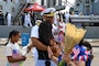 A Sailor embraces family.