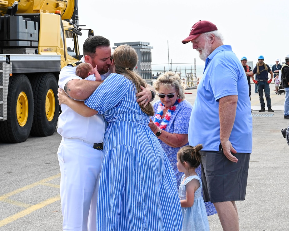 A Sailor embraces family.