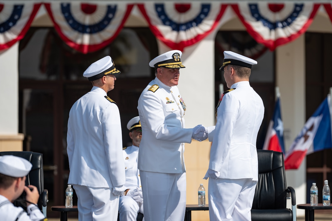 Naval Station Rota leadership salutes and conducts honors for Change of Command.