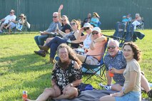 Concert goers sit back and enjoy country music performed by Chase Bryant. Bryant was the headliner of a free concert hosted by NOTU’s Morale, Welfare, and Recreation as part of NOTU’s 75th anniversary celebration June 7. The concert was set outdoors near the USS Nathanael Greene submarine sail, across from the NOTU MWR Greenhouse. The concert was open to all Department of Defense ID card holders and their family members and friends.