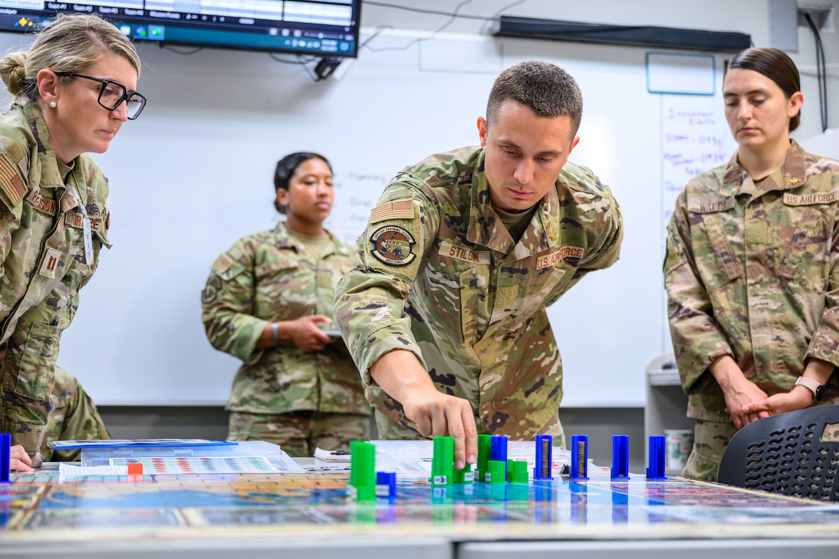 Airmen participate in a wargaming drill as part of Officer Training School at Maxwell Air Force Base, Ala., June 1, 2025. Civilians and prior enlisted service members with college degrees undergo a 60-day training program at the school, culminating in their commissioning as officers in the Air Force or Space Force. (U.S. Air Force photo by Damien Thomas)