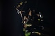 Firefighter in dark room with only high visibility reflectors showing