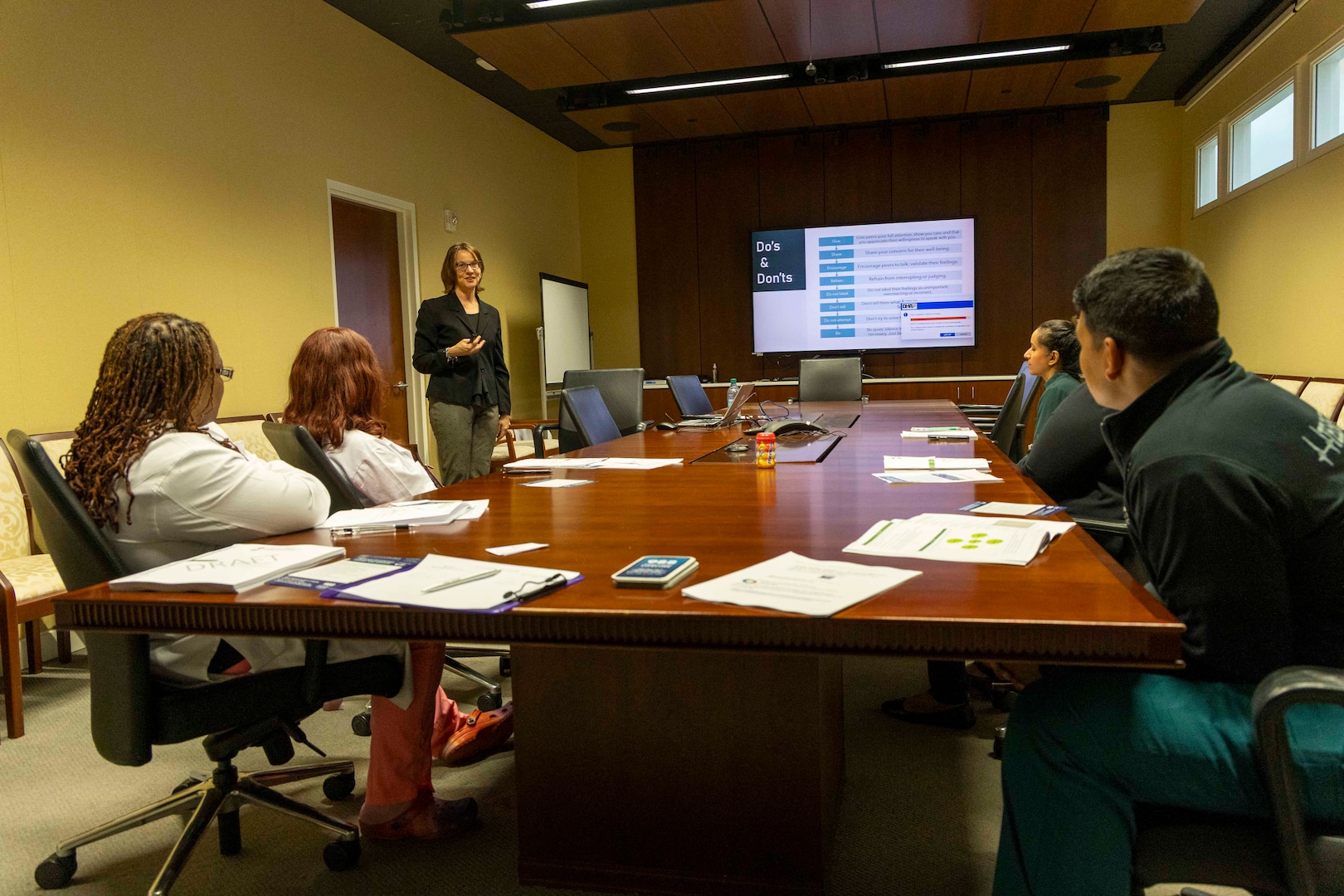 Leianne Pouliot, a licensed clinical social worker at Walter Reed National Military Medical Center, conducts a recent Peer Connect training for employees. The Peer Connect program is available to all staff upon request, facilitated by a select group of leaders who have volunteered to serve as peer support mentors, offering their time, empathetic ears, and wisdom. (DOD photo by Roan Smith)