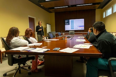 Leianne Pouliot, a licensed clinical social worker at Walter Reed National Military Medical Center, conducts a recent Peer Connect training for employees. The Peer Connect program is available to all staff upon request, facilitated by a select group of leaders who have volunteered to serve as peer support mentors, offering their time, empathetic ears, and wisdom. (DOD photo by Roan Smith)