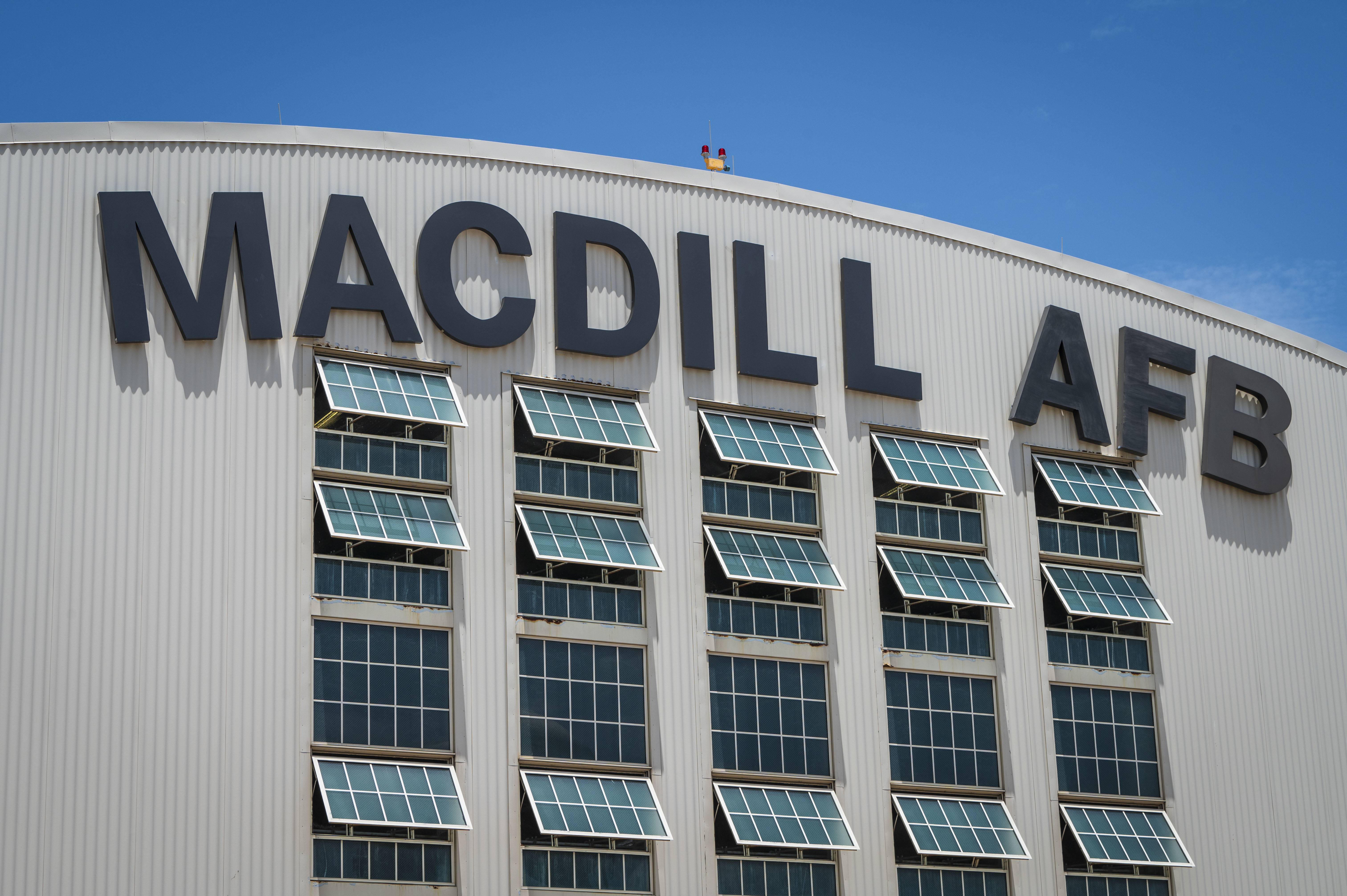 The front of Hangar 3 is shown at MacDill Air Force Base, Florida, June 6, 2025. The letter “C” was blown off the hangar during Hurricane Helene, a Category 4 hurricane that hit the region in September 2024. Since then, extensive repairs have been completed, with the recent restoration of the iconic MacDill AFB sign symbolizing the base’s recovery from the hurricanes. (U.S. Air Force photo by Airman 1st Class Alicia Campbell)